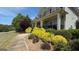 Attractive home with a large front porch and colorful, well-maintained landscaping at 109 Lighthorse Blvd, Mcdonough, GA 30252