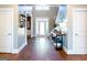 Elegant foyer with hardwood floors, a high ceiling, and a view of the front door and staircase at 109 Lighthorse Blvd, Mcdonough, GA 30252