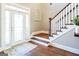 Foyer with staircase, hardwood floors, and sidelight windows at 109 Lighthorse Blvd, Mcdonough, GA 30252