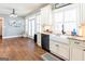 Bright kitchen with white cabinets, granite countertops, and stainless steel appliances at 109 Lighthorse Blvd, Mcdonough, GA 30252