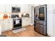 Kitchen features stainless steel appliances, white cabinetry, and modern finishes, creating a culinary haven at 109 Lighthorse Blvd, Mcdonough, GA 30252