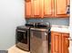 Laundry room with front-load washer and dryer, plus a utility sink at 109 Lighthorse Blvd, Mcdonough, GA 30252