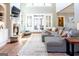 Spacious living room with fireplace, large sectional sofa, and lots of natural light at 109 Lighthorse Blvd, Mcdonough, GA 30252