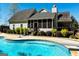 Gorgeous in-ground pool with diving board, and patio area for outdoor entertaining and relaxation at 109 Lighthorse Blvd, Mcdonough, GA 30252