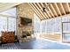 Outdoor living space with a stone fireplace, tv, and an open-air design offering a cozy and inviting atmosphere at 109 Lighthorse Blvd, Mcdonough, GA 30252