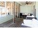 Inviting screened-in porch with comfortable seating and stylish decor, perfect for outdoor relaxation and entertaining at 109 Lighthorse Blvd, Mcdonough, GA 30252