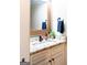 Powder room with granite countertop, framed mirror, and decorative fixtures at 109 Lighthorse Blvd, Mcdonough, GA 30252