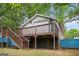 Back of house features a deck accessible by stairs, with basement access below at 3378 La Vista, Hapeville, GA 30354