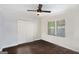 Bedroom with neutral walls, ceiling fan, hardwood floors, and a large closet at 3378 La Vista, Hapeville, GA 30354