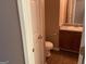 Cozy half-bathroom featuring a pedestal sink and wood-look vinyl floors at 1028 Field View Dr, Mcdonough, GA 30253