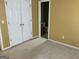 Bedroom featuring closet with double doors and an en-suite bathroom at 1028 Field View Dr, Mcdonough, GA 30253