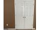A close up view of white closet doors with simple design and gold colored knobs at 1028 Field View Dr, Mcdonough, GA 30253