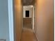 A hallway with neutral walls and carpet, offering a glimpse into other rooms at 1028 Field View Dr, Mcdonough, GA 30253
