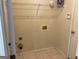 Practical laundry room featuring tile floors and hookups at 1028 Field View Dr, Mcdonough, GA 30253