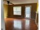 Empty living room with wood floors, bright light, and neutral walls at 1028 Field View Dr, Mcdonough, GA 30253