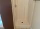 A bright, white shower stall with textured walls and flooring at 1028 Field View Dr, Mcdonough, GA 30253