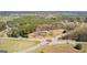 Aerial view of land near a roundabout, surrounded by an abundance of beautiful lush green trees at 315 S Bethany Rd, Mcdonough, GA 30252