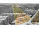 Aerial view of land with a home close to a roundabout with surrounding trees and property lines highlighted at 315 S Bethany Rd, Mcdonough, GA 30252
