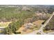 Aerial view of land with a home close to a roundabout with surrounding trees at 315 S Bethany Rd, Mcdonough, GA 30252