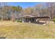 View of the home from the back, showing a covered patio and spacious yard at 315 S Bethany Rd, Mcdonough, GA 30252