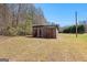 A single one-room outbuilding that is clad in weathered tin siding at 315 S Bethany Rd, Mcdonough, GA 30252