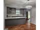 Contemporary kitchen with gray cabinets, quartz countertops, and stainless steel appliances at 487 Eastside Dr, Dacula, GA 30019