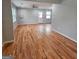 Spacious open floor plan with refinished hardwood floors, neutral walls, and ample natural light at 487 Eastside Dr, Dacula, GA 30019
