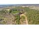 A landscape aerial view, featuring a mix of green trees and open land, highlighting nature at 461 Old Jackson Rd, Mcdonough, GA 30252