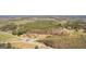 Aerial view of wooded lot featuring mature trees, open space, and roundabout access at 461 Old Jackson Rd, Mcdonough, GA 30252