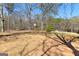 Large backyard featuring mature trees and ample space for outdoor activities at 461 Old Jackson Rd, Mcdonough, GA 30252