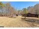 Rustic barns offer ample storage and character on this sprawling property at 461 Old Jackson Rd, Mcdonough, GA 30252