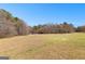 Rustic outbuildings located in a wide open field surrounded by mature trees and a tranquil setting at 461 Old Jackson Rd, Mcdonough, GA 30252