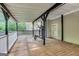 Large covered back deck with weight-lifting equipment for staying active at 365 Othello Dr, Hampton, GA 30228