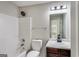 Secondary bathroom featuring a single sink vanity, tub and shower combo, and a neutral color palette at 365 Othello Dr, Hampton, GA 30228