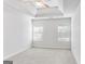Bedroom with neutral carpet, fan, and two windows for natural light at 365 Othello Dr, Hampton, GA 30228