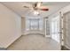 Large bedroom with bay window, ceiling fan, and private access to a bathroom at 365 Othello Dr, Hampton, GA 30228