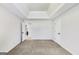 Empty bedroom with neutral carpet, two entryways, and access to a bathroom at 365 Othello Dr, Hampton, GA 30228