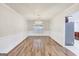Elegant dining room featuring hardwood floors, wainscoting, and a decorative chandelier at 365 Othello Dr, Hampton, GA 30228
