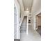 Bright foyer featuring a staircase, white trim, and marble tile flooring at 365 Othello Dr, Hampton, GA 30228