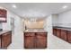 A modern, open kitchen with an island, granite countertops, and stainless steel appliances is great for entertaining at 365 Othello Dr, Hampton, GA 30228