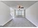 Spacious living room with neutral carpet, a ceiling fan, and natural light from bay windows at 365 Othello Dr, Hampton, GA 30228
