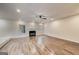 The spacious living room boasts natural light, wood flooring, and a cozy fireplace, creating an inviting space at 365 Othello Dr, Hampton, GA 30228