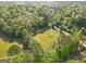 Aerial view of a lush, green landscape, featuring a blend of open space and woodlands for ultimate privacy at 2331 Hollonville Rd, Brooks, GA 30205