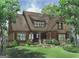 Charming Craftsman-style home with stone accents, covered porch, and professionally landscaped front yard at 2331 Hollonville Rd, Brooks, GA 30205