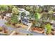 Aerial view of an estate home with well-manicured lawns, and a tranquil lake nearby at 216 Southwick Ln, Peachtree City, GA 30269