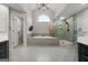 Large bathroom featuring separate shower, tub, and double vanities at 216 Southwick Ln, Peachtree City, GA 30269