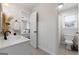 Bathroom showcasing a sink and partial view into an additional bathroom and bedroom at 216 Southwick Ln, Peachtree City, GA 30269