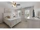Bright bedroom featuring a ceiling fan, carpeted floors, and plenty of natural light at 216 Southwick Ln, Peachtree City, GA 30269