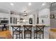 Well-lit kitchen with stainless steel appliances and a breakfast bar area at 216 Southwick Ln, Peachtree City, GA 30269