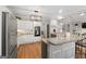 Spacious kitchen with updated stainless appliances, granite countertops, and hardwood floors at 216 Southwick Ln, Peachtree City, GA 30269
